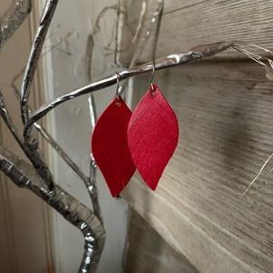 Red feather shaped earrings